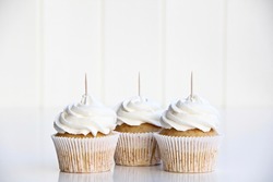 3 white cupcakes with stick for toppers. Cupcake mock up