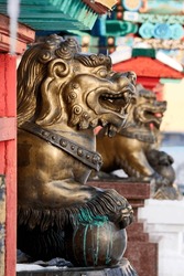 Bronze figures of lions in the Buddhist temple