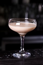 Baileys liqueur in glass on dark background. bar alcohol cocktail menu Milk liqueur. evening, club, concept