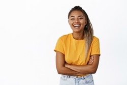 Happiness and people. Laughing Black woman smiling and looking carefree, joyful chuckle over smth funny, standing over white background