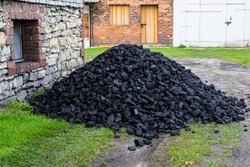 a pile of hard coal in front of the house, supplies for the winter