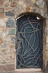 old metal door in stone wall. High quality photo