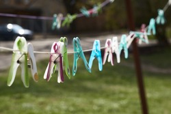 Clothespins and Clothes line on blur background 
