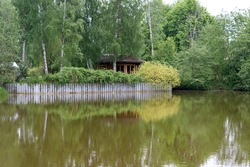 Summer wooden Lake house inside forest . High quality photo
