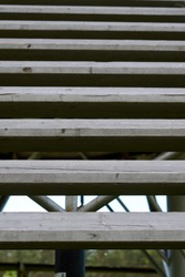 Old gray wooden stairs. Diagonal lines. Abstraction. From big to small stripes. High quality photo