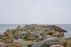 Rocky coastal landscape scene at shore of ocean. High quality photo