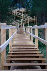 Long wooden stairs in forest. High quality photo
