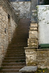 Old stone abandoned staircase in the city. High quality photo