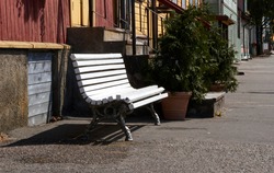 white wooden bench in the street, park bench, break. High quality photo