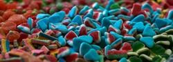 Assorted gummy candies and jellies as background. A lot of colorful jelly sweets candy flavor. Selective focus. High quality photo