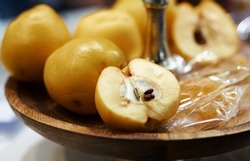 Tincture of quince and fruit on a wooden table. Selective focus. High quality photo