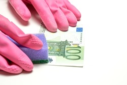 Money laundering in offshore and criminal capitals. The concept of anti laundering money ALM. 100 (hundred) euro, glowes and dishwash in a white background. High quality photo