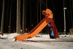 Nobody in the snow covered children's playground. Winter time, night view. High quality photo