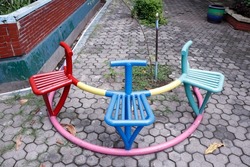 Unique colorful iron chairs in the park