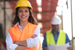 Portrait of confident female construction worker at construction site