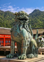 Bronze Lion dog statue in Itsukushima, Japanese Shinto Shrine on Miyajima Island, Japan.