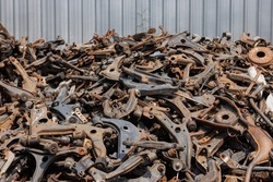 heap of waste automotive parts in recycle factory. scrap metal - predominantly ferrous metals. Waste from industry and household in recycle factory. scrap metal - predominantly ferrous metals. 