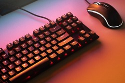 Red gaming keyboard. Keyboard with mouse, neon light. Mechanical keyboard with Red light. gaming concept. hacker concept.
