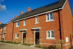 New modern built houses in England UK. Fresh new homes on new housing estate.
