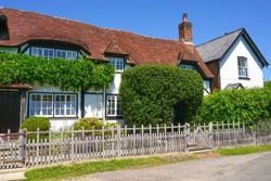 Country home in small English village. Front exterior of large rural cottage house.