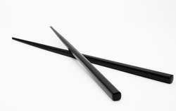 black food chopsticks on white background