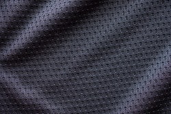 Black fabric sport clothing football jersey with air mesh texture background