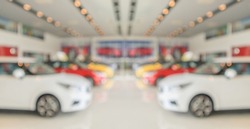new cars in showroom interior blurred abstract background