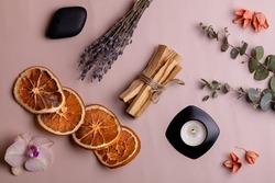 Ritual objects for meditation, relaxation and aromatherapy Palo Santo sticks, candle, natural plant aromas. Top view, flat lay, copy space.