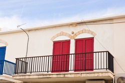 balcony with red doors