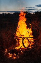 a bonfire in which an old wooden chair burns. High quality photo