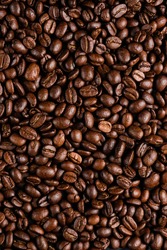 Rich dark brown coffee beans closeup shot 