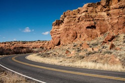 Route 66 and a red rock cliff face in Arizona