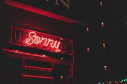 A hotel sign says sorry.