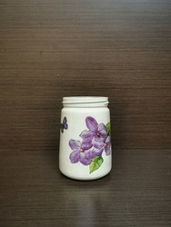white decoupage vase with floral print, beautiful handmade DIY decoupage flower vase on wooden background