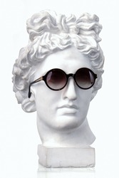 Plaster white bust Appolon head in sunglasses