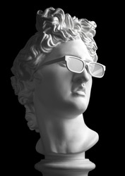 Statue. Gypsum statue of Apollo's head. Man. Creative. Plaster statue of Apollo's white sunglasses. David Apollo. Sculpture. Apollo Belvedere. 