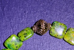 A bracelet made of natural kiwi jasper and beautiful bead.