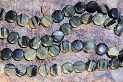 Beads in the shape of a coin made of natural silver jasper.