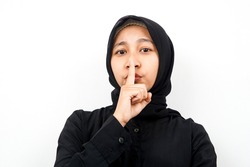 Closeup of a beautiful young Muslim woman shh, forbidden to talk, please be quiet, isolated