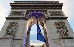The Triumphal Arch decorated with European flag, Paris, France. It is one of the most famous monuments in Paris. It honors those who fought and died for France.
