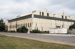 Big white industrial factory building at Stanton Ironworks, Derbyshire, UK