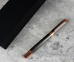 Luxury Roller Pen Ball Pen gift in box, copper and grey self textured VIP gifts. Black gift box featuring business gift. Promotional gifts and premiums for corporate companies. Office give aways.