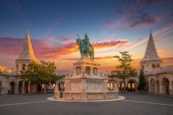 Budapest, Hungary - Amazing golden sunrise over Fisherman's Bastion with King Saint Stephen statue and an amazing colorful sky at autumn