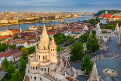 Budapest, Hungary - Aerial view of Fisherman's Bastion at sunset with Szechenyi Chain Bridge, St.Stephen's Basilica and Buda Castle Royal Palace at background on a sunny summer afternoon