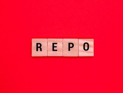 Alphabet word with red background REPO description. REPO stands for Repurchase Agreement.