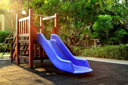 Children playground under sunlight - blue slider