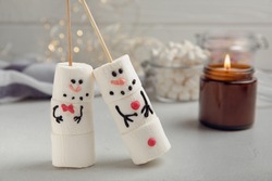 Snowman made of marshmallows.Cocoa drink.Sweet treat for kids funny marshmallow snowman. Christmas winter holiday decoration. New Year card.Winter hot drink.