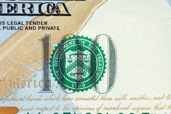 The green seal on one-hundred-dollar represents the U.S. Department of the Treasury.