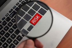 risk lettering on red key on computer keyboard.risk concept idea