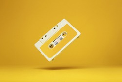 Audio cassette on colored background. Vintage audio cassette tape. Vintage disco poster. 